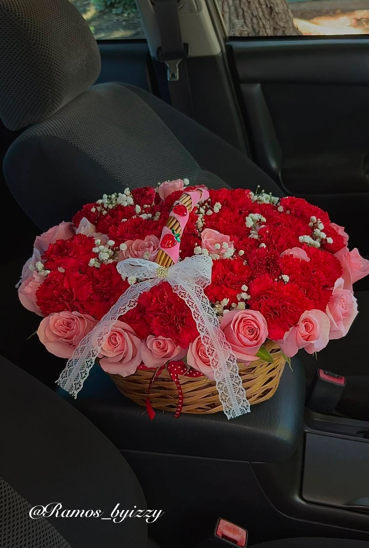 Red and pink flower basket with lace bow